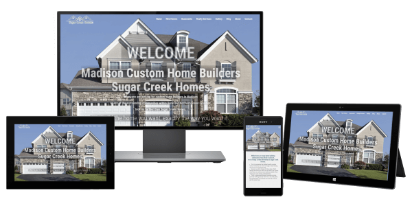 Custom Home Builder website displayed on desktop monitor, phone, tablet